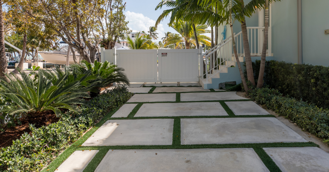 Artificial grass driveway with square pavers