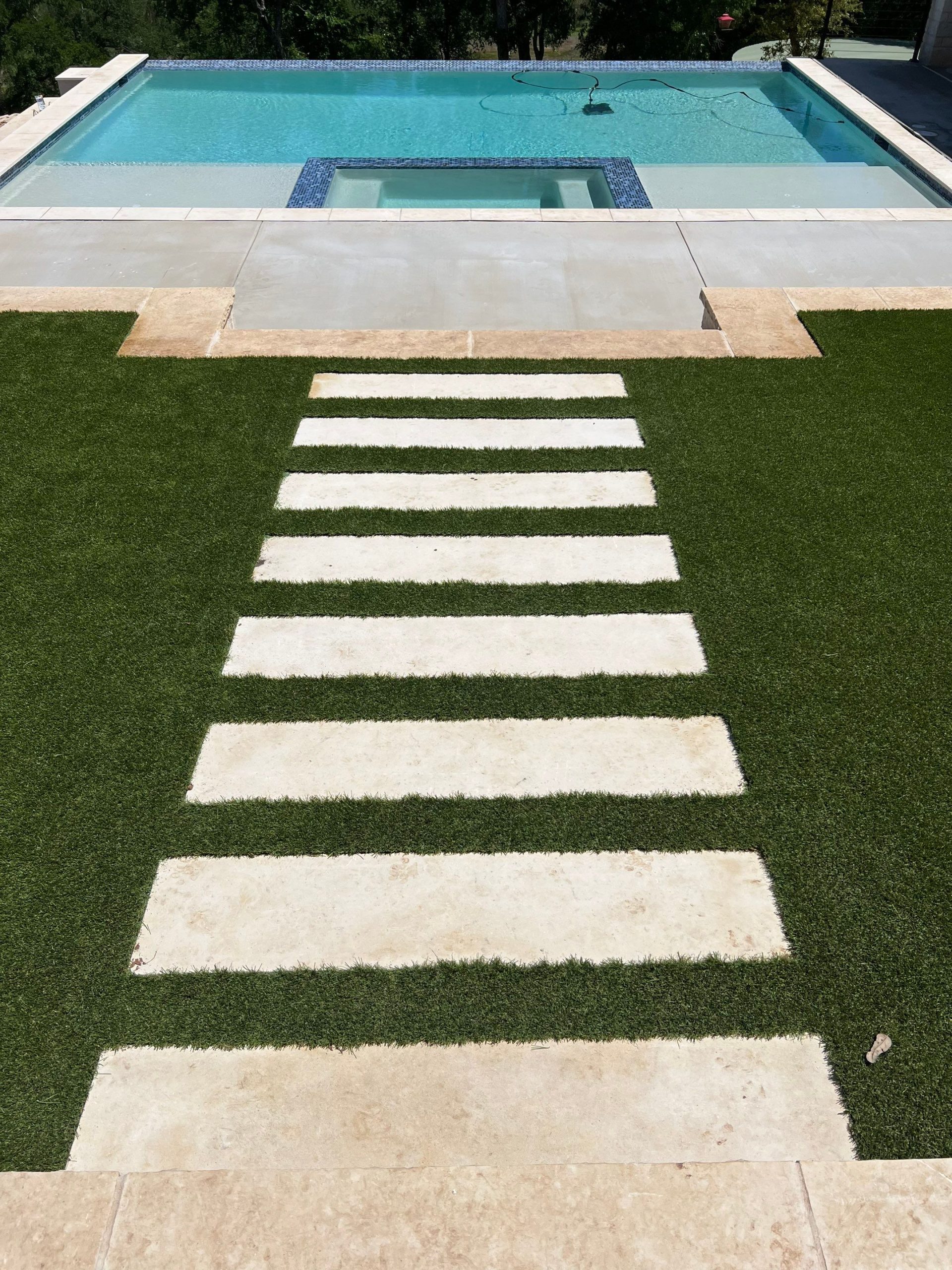 Low-Maintenance Turf Yard with Washer Pit and Putting Green in Spicewood, TX
